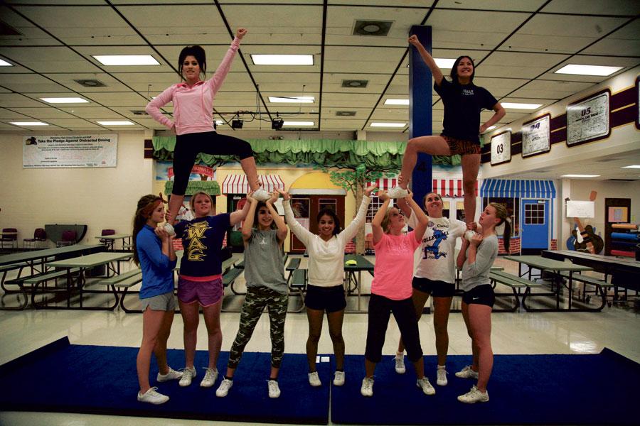 WHS cheerleaders practice in the commons for the homecoming assembly. This is the first year WHS will send a cheer squad to compete competively against other squads in Washington state. 