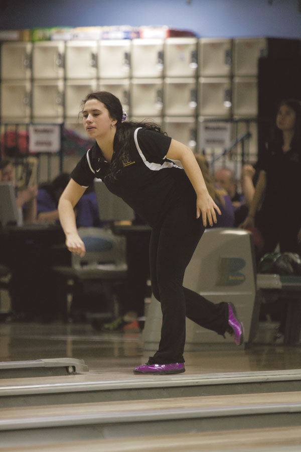Senior Alexis DaSilva watches her ball roll towards the pins on Jan. 14 at Eastmont Lanes against Eisenhower. DaSilva bowled a 180, compared to her high for the season of 190. The undefeated Panthers beat Eisenhower 2,041-1,621.