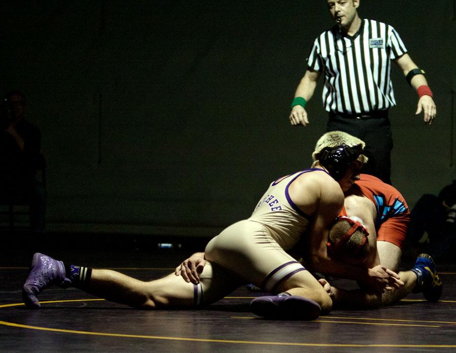 Junior Logan Tidd (weight class 160 pounds) attempts to pin his opponent. Tidd lost the match. 