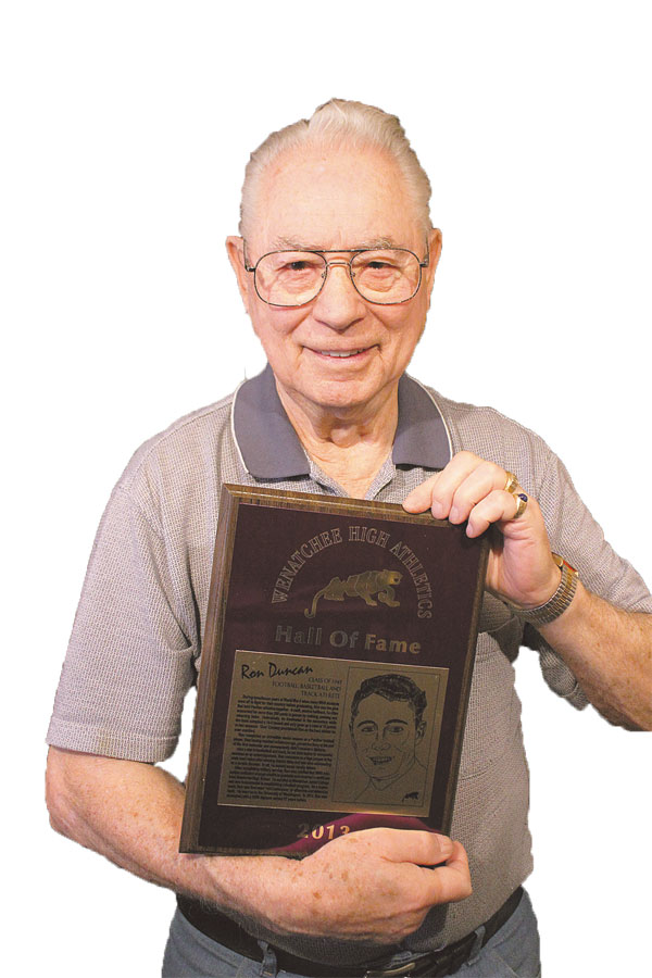 Ron Duncan is pictured with his Hall of Fame plaque that he was awarded after he was issued his high school diploma 67 years after his class due to being drafted into World War II.