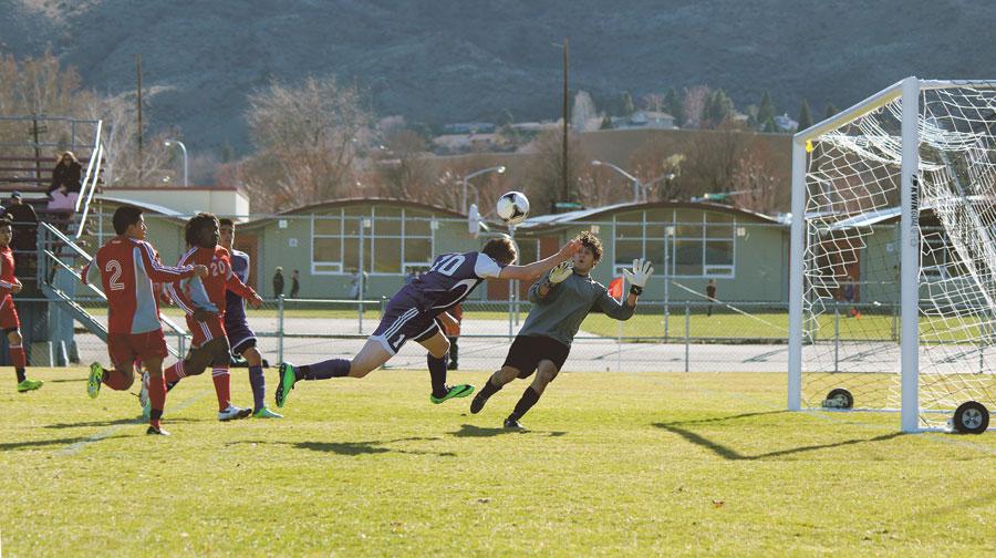 Senior Tyler Miller dives towards the goal and attempts a header on March 14 at the team’s opening jamboree at The Apple Bowl. The Panthers played two games against Cascade (Leavenworth) and Cashmere, winning 1-0 and 5-0.