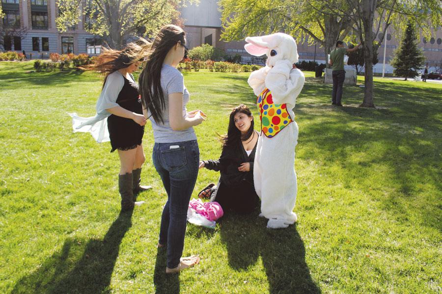 Senior Maria Benitez, junior Alissa Salazar, and junior Andrea Garnica help the Easter Bunny get dressed before FBLA’s Easter egg hunt on April 15 at Memorial Park. FBLA put on the hunt to engage children from Bruce Transitional Housing. 