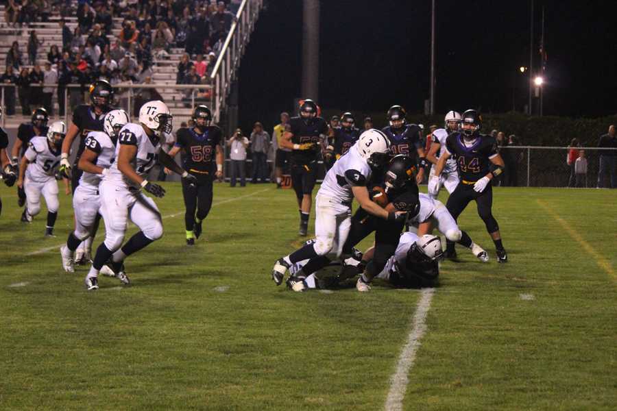 A Wenatchee Panther football player is tackled during the game against Chiawana on Sept. 12. The Panthers lost 42-7.