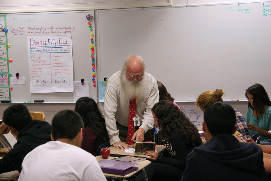 New English teacher William (Bill) Higgins provides individual support during one of his classes last week. Higgins is one of many staff members added at WHS this year.