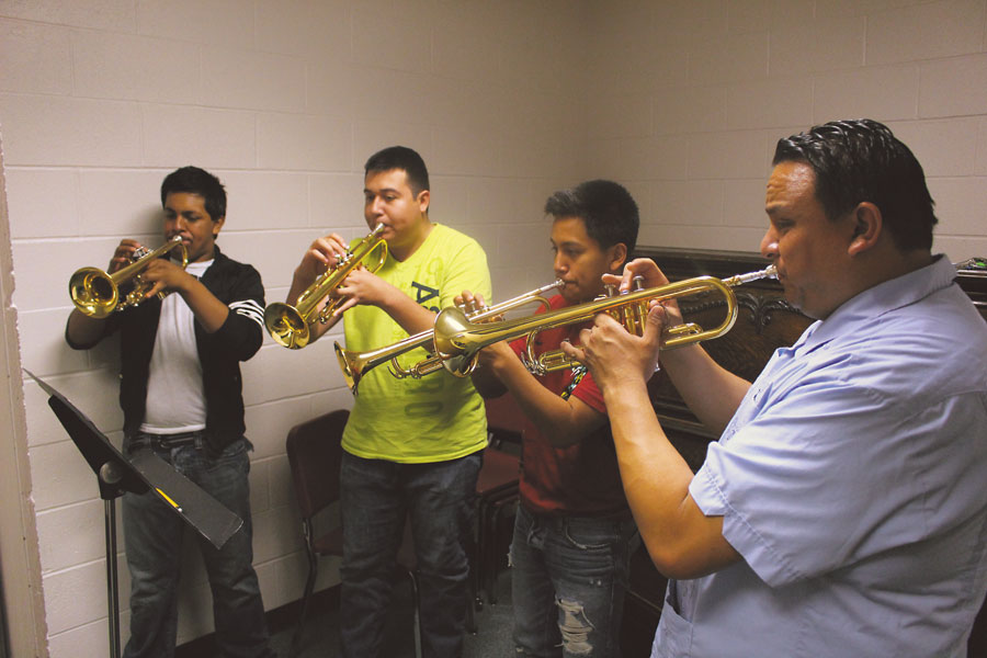Senior Juan Cedeno, senior Martin Meza, junior Jose Machado and WHS mariachi director Ramon Rivera practicing mariachi music in a practice room. When Rivera took over the program, the graduation rate stood at 58 percent. As of 2009, the rate stands at 100 percent.