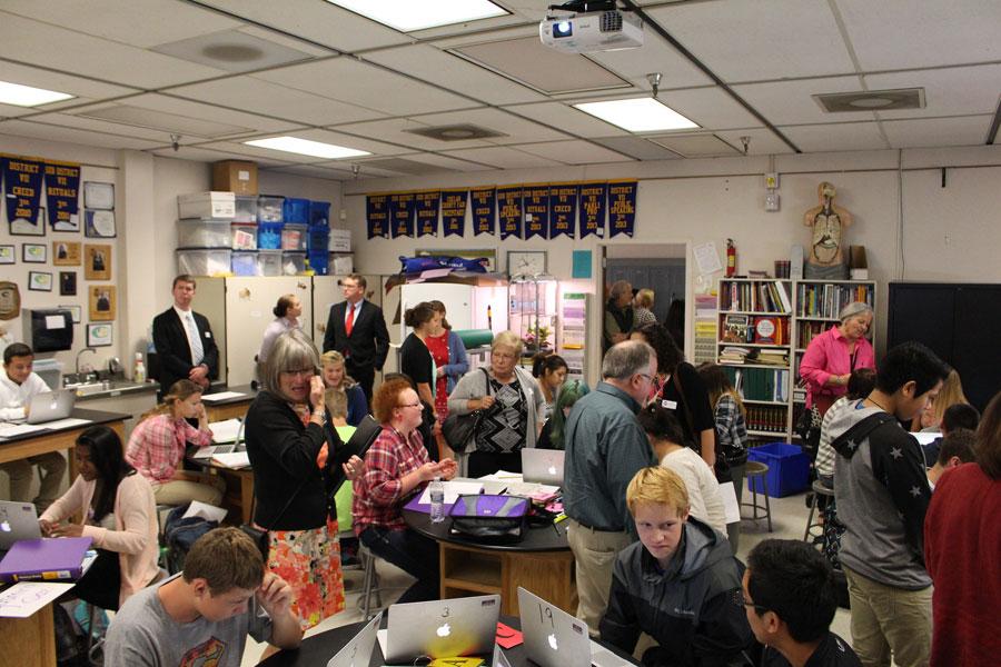 Washington State Board of Education members watch a science class at WHS Thursday. The team visited Wenatchee for planning and a retreat last week. 