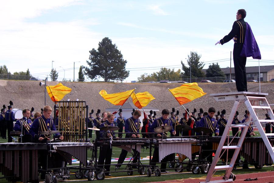 The Golden Apple Band is and led by junior Kevin Wilson during the field show at the Cavalcade of Bands. 