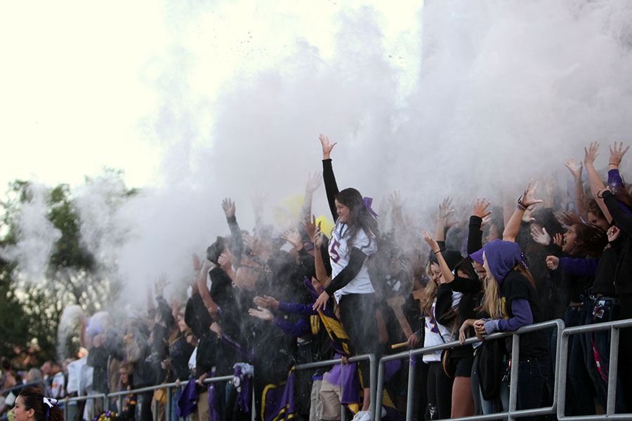 Students in the Panther Pit throw flour at kick-off as the Eastmont football game begins Oct. 10.