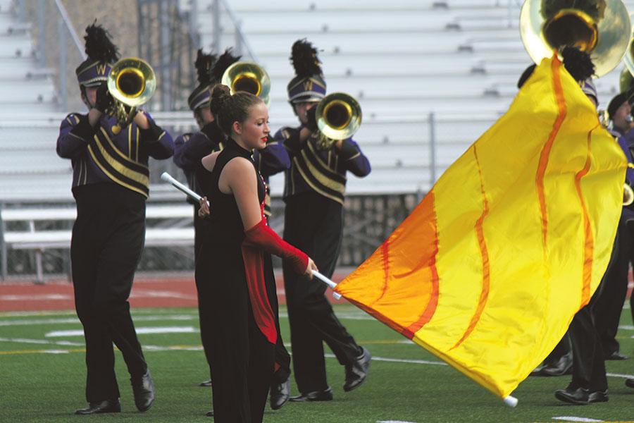 The Wenatchee High School GA Band color guard performs with fellow band members on Oct. 4 in Pasco.