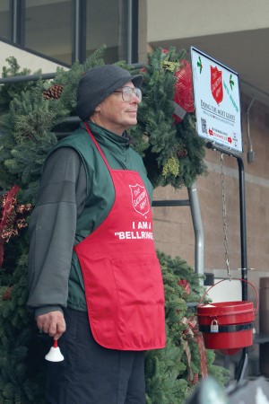 Salvation Army Bell Ringer John Hill works a shift in front of Wenatchee's Safeway on Dec. 9. 