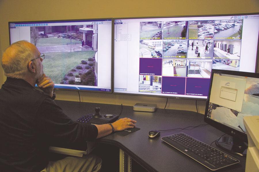 Safety and Security Officer Don Durden monitors the cameras of Wenatchee High School in the newly updated security control room. WHS has nearly 80 cameras in full-time use. 