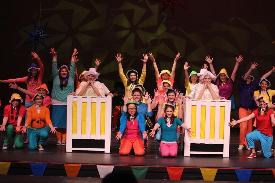 The ensemble cast performs a musical number about babies at the beginning of the show.