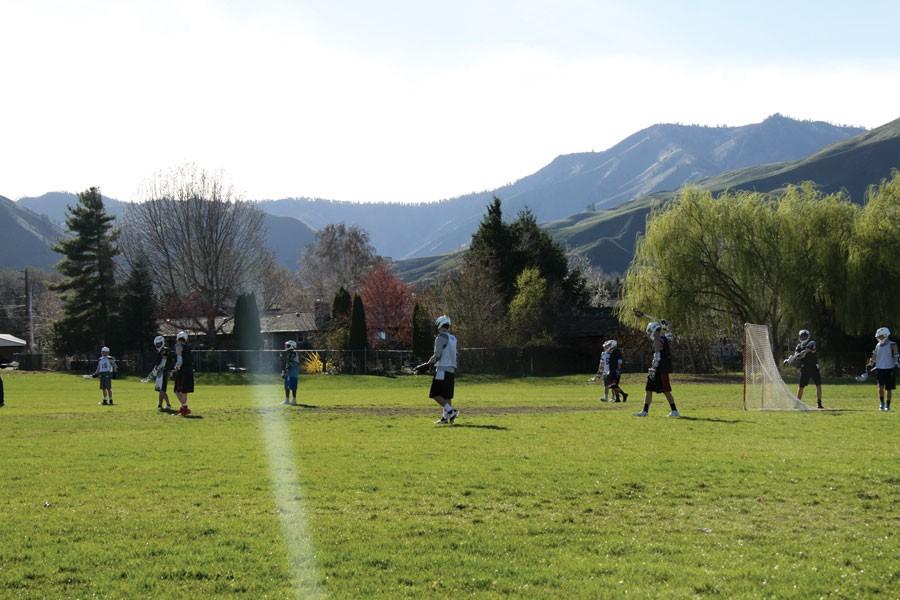 The Wenatchee Valley Thunder lacrosse team practices at Newbery Elementary School recently. 