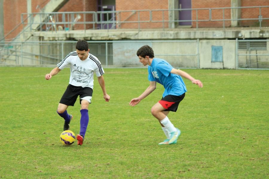 Sophomores Ivan Chaves and Lorren Morgan practice in the Apple Bowl for their upcoming home game against Sunnyside on March 27.