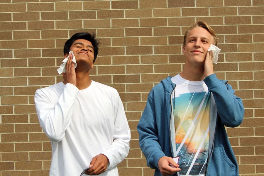 Sophomores Marcus Garcia and Rowan Parmenter experiment with their new facial cleansing wipes. 