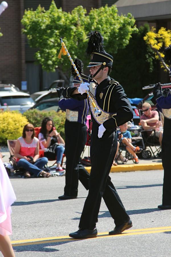 Junior Golden Apple Marching Band drum major Kevin Wilson leads the Wenatchee High School band down Wenatchee Avenue on Saturday, May 2 during the Apple Blossom Grand Parade.