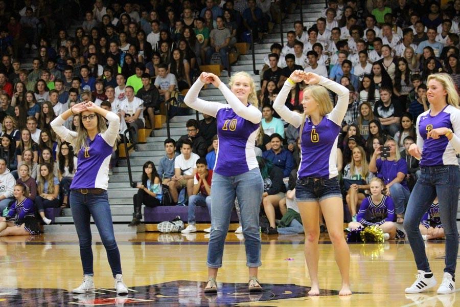 The girls volleyball team rocks out to a dance number.