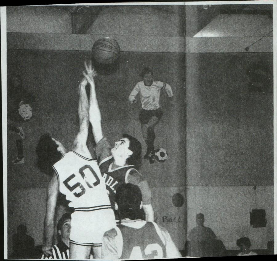 Principal Eric Andersons old teammate at Shadie Park High School, Scott Pfeffer, reaches to grab the ball from his opponent. Photo courtesy of Eric Anderson.
