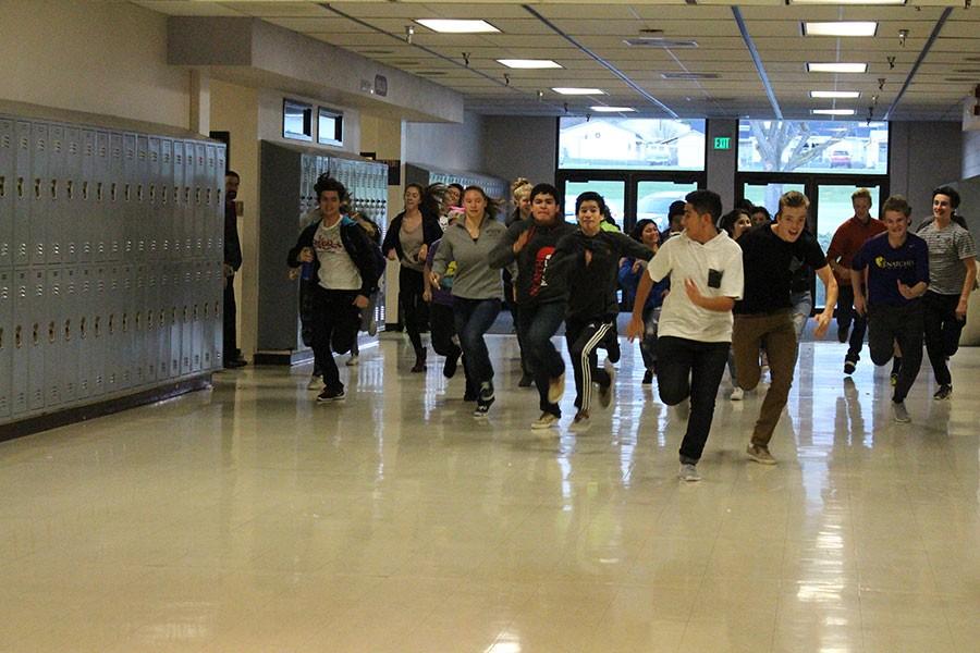 Students thunder through the halls of Wenatchee High School at the beginning of the race.