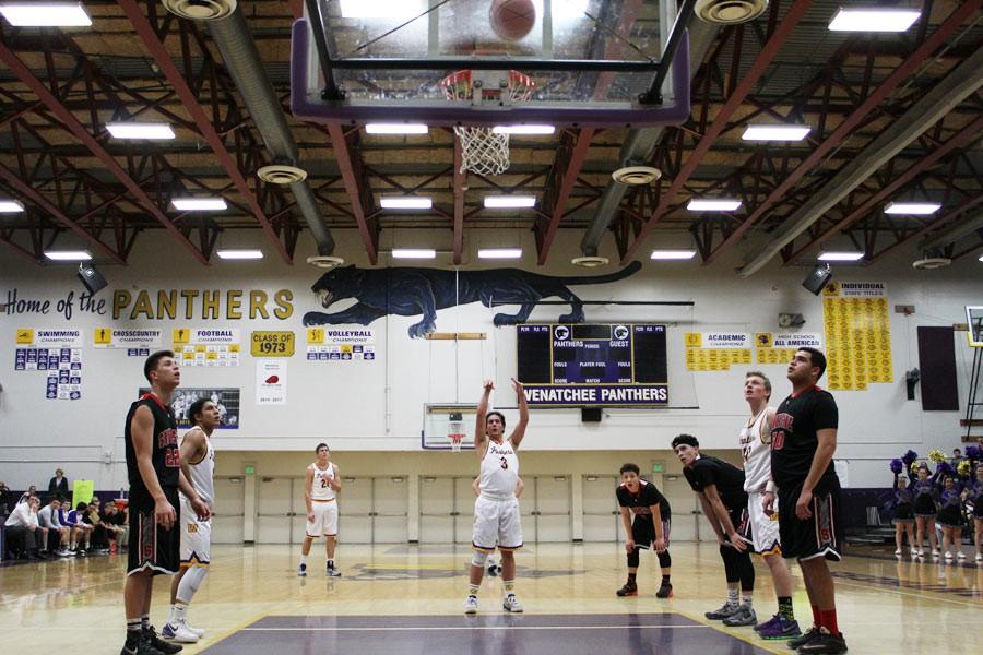 Senior+Colin+Goff+shoots+a+free+throw+in+the+boys+basketball+varsity+playoff+game+at+Wenatchee+High+School+last+night.
