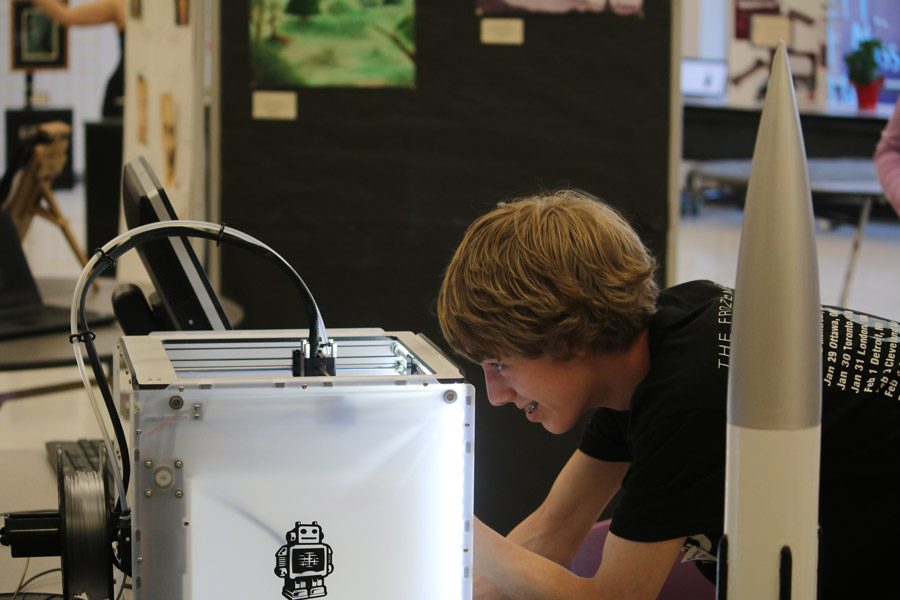 Junior Brandon Fitzgerald watches a 3D-printer at work. 
