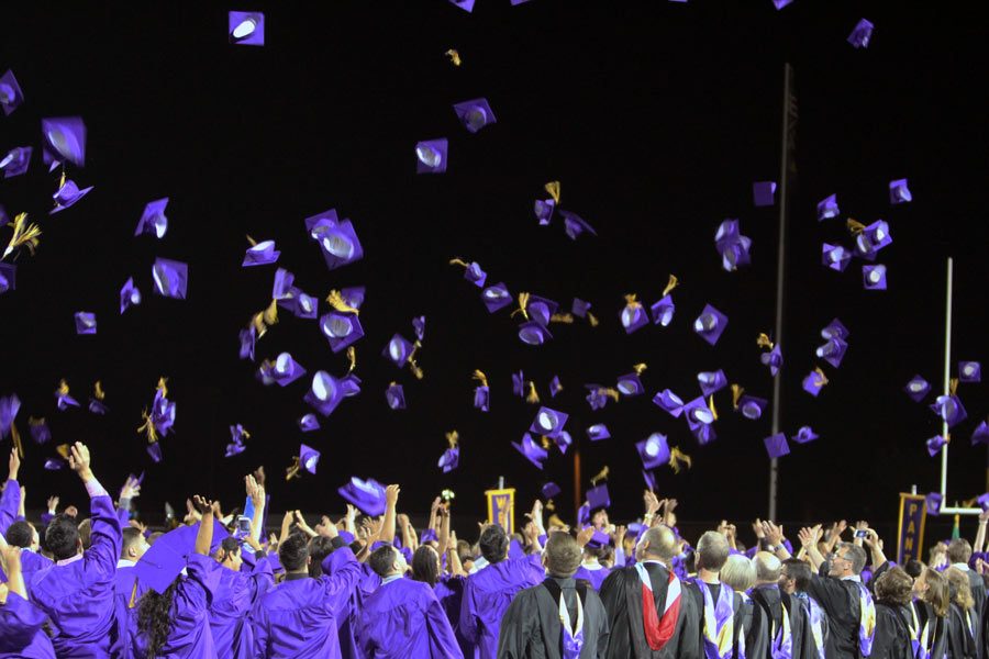 The graduating class of 2016 throws their caps into the air, their four-year journey with each other complete. 