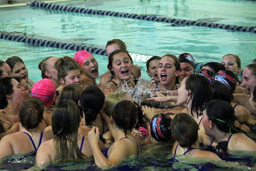 Wenatchee+and+Eastmont+swimmers+unite+for+a+cheer+after+the+meet.