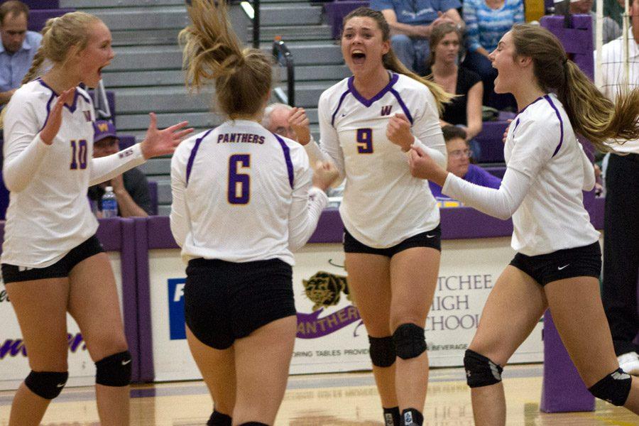 Dexter celebrates with her teammates after a kill. 
